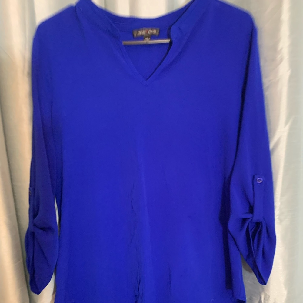 Women’s blue blouse size large.